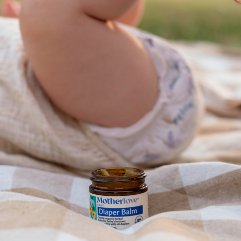 Baby with diaper and diaper balm