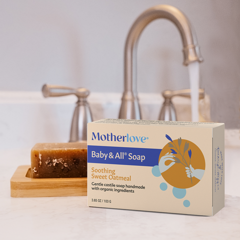 Carton of Motherlove Soothing Sweet Oatmeal Soap with a bar of soap and sink in the background