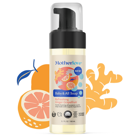 Bottle of Motherlove Baby and All Soap - Ginger Grapefruit with illustrated fruit behind the bottle